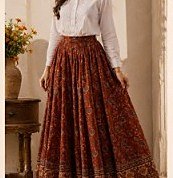 Long rust printed cotton skirt with a white shirt