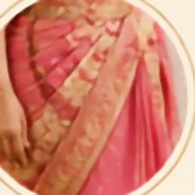 A pink saree pleated and finished at the fall